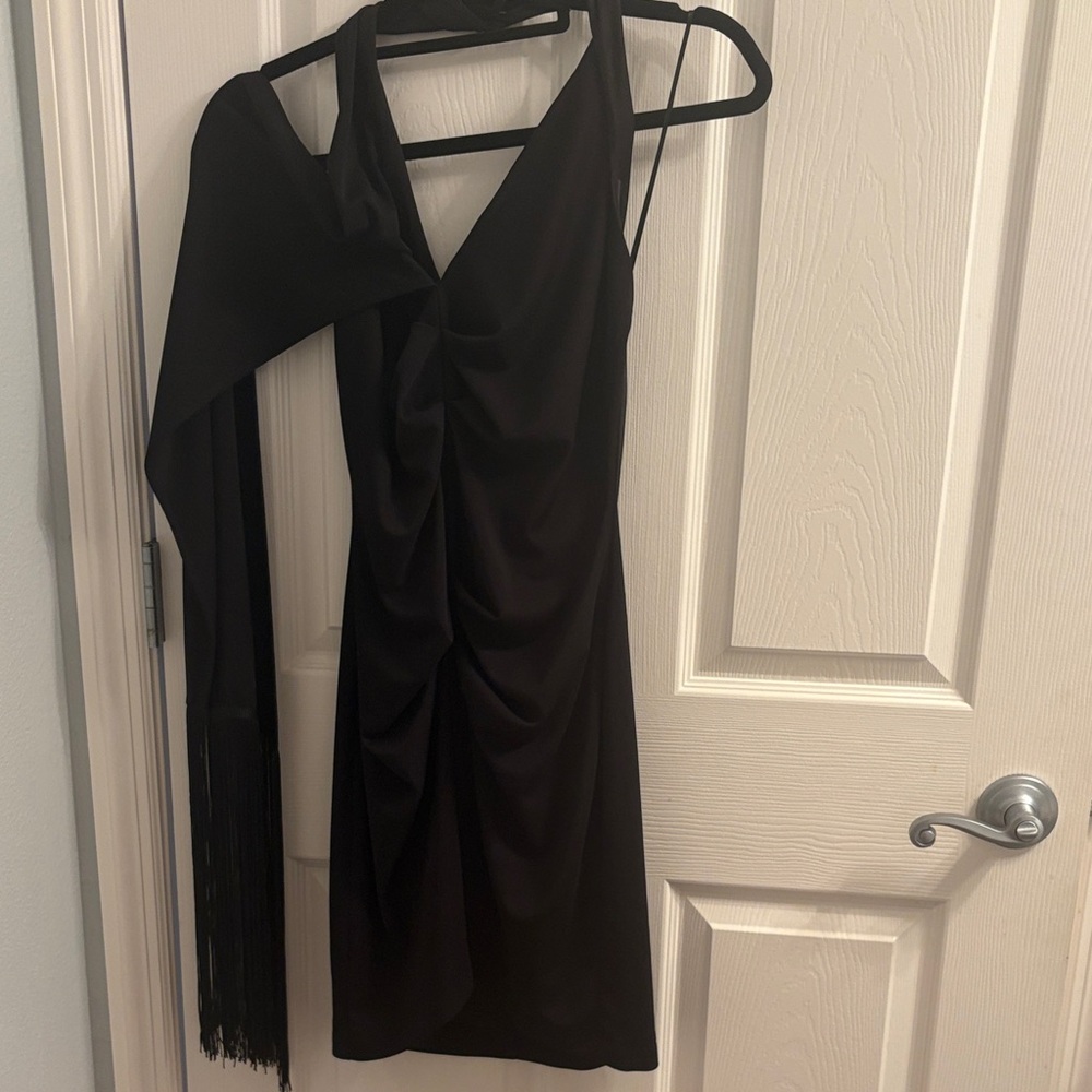 Black halter dress with fringed scarf attached. NWT,perfect little black dress!